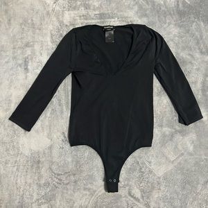 Women’s Bebe black Stretch 3/4 sleeve bodysuit size small